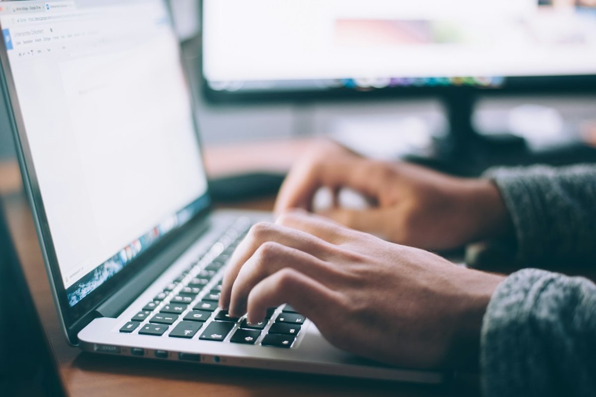 Solo maker reviewing support emails and notes to pick the five most common help topics